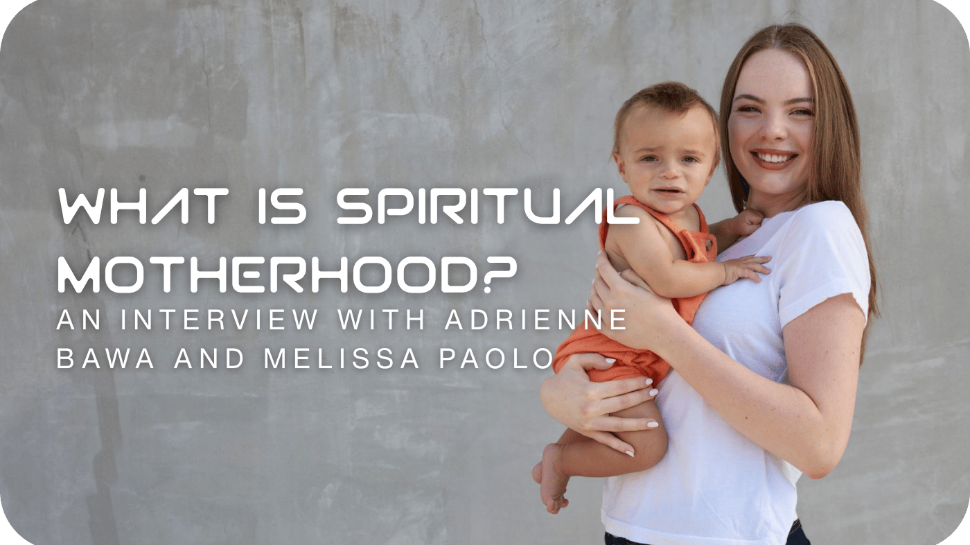 a young mother holding her child against a gray backdrop what is spiritual motherhood
