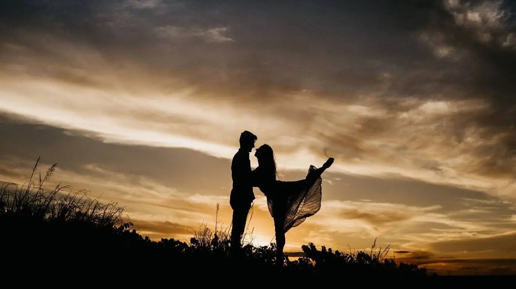 Twin flame or soulmate connection silhouette at sunset 