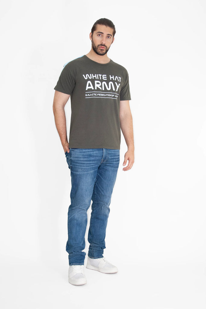 A man wearing a WHITE HAT ARMY TEE IN CALADAN t-shirt and jeans from GFLApparel.