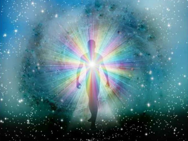 being with light radiating from heart against starry background