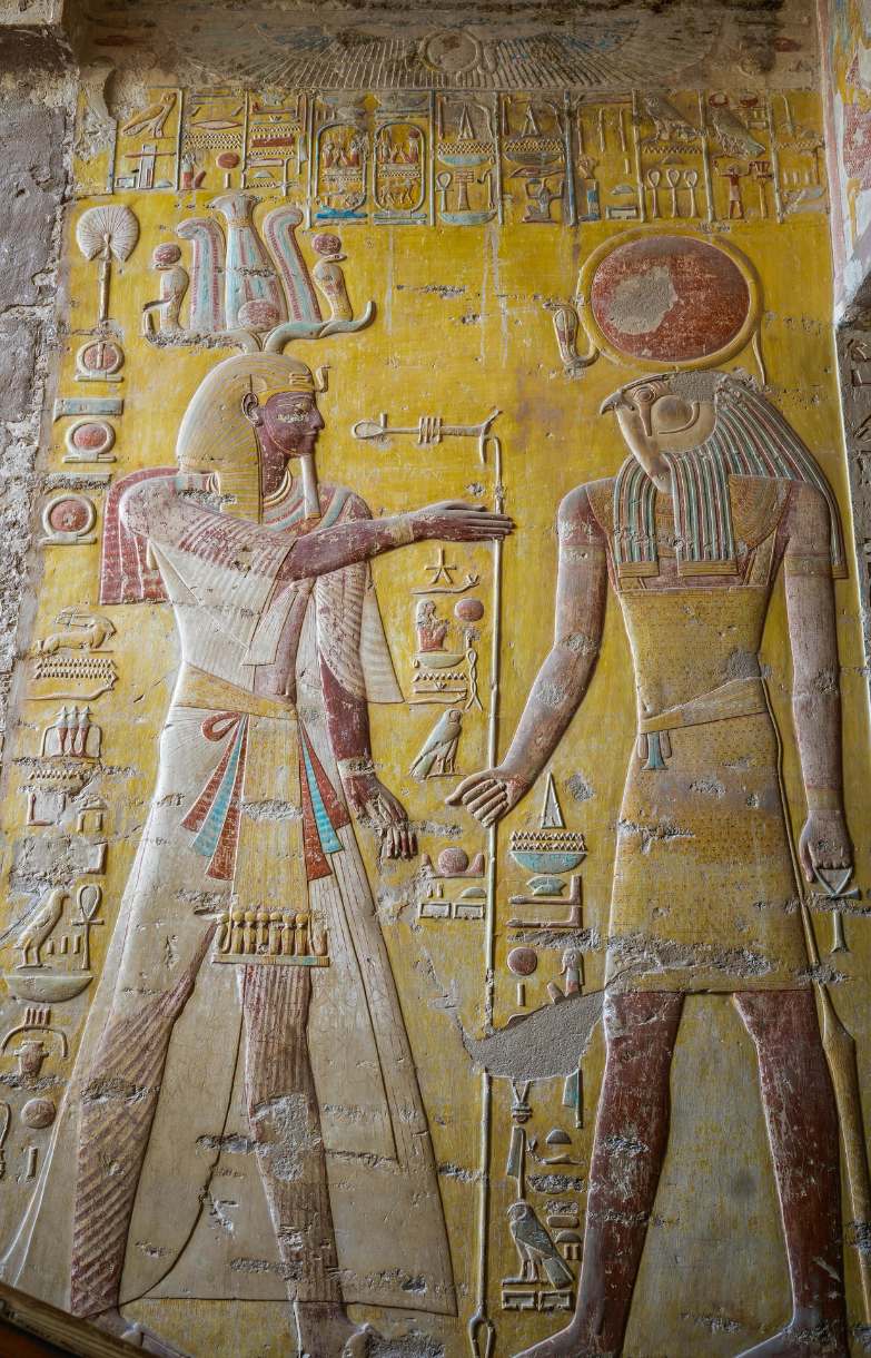 Elaborate ancient Egyptian artwork on a wall.