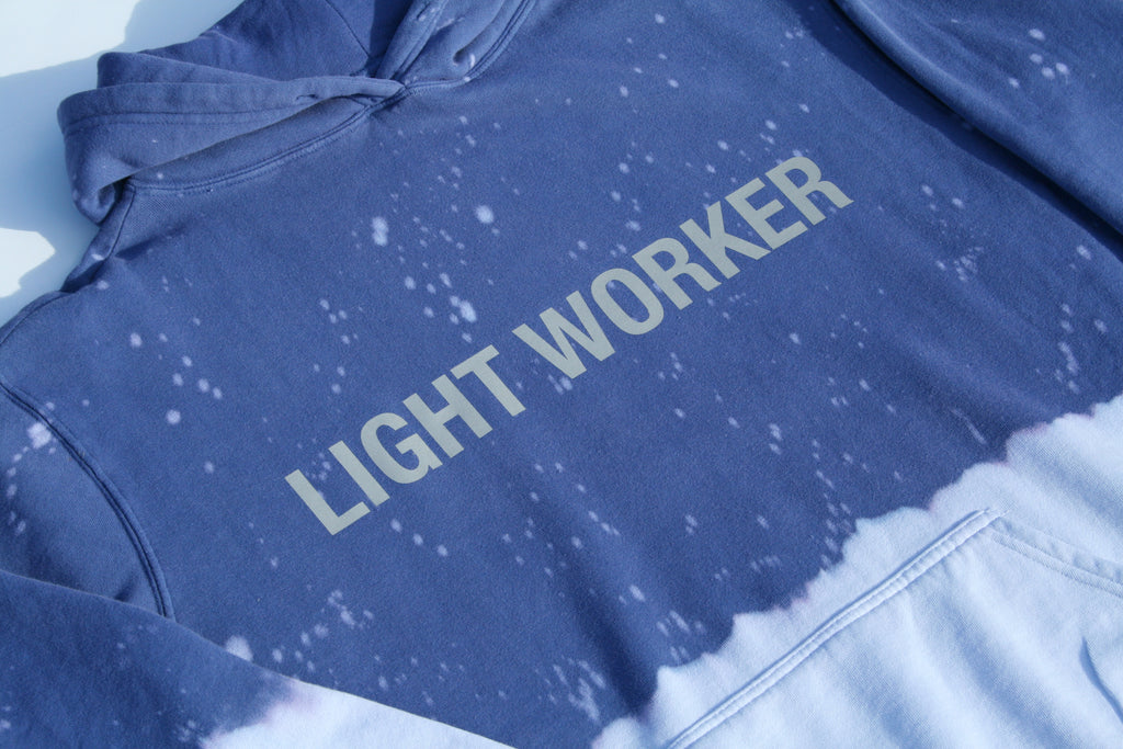 A LIMITED EDITION LIGHT WORKER HOODIE in Indigo Child by GFLApparel with the word light worker on it.