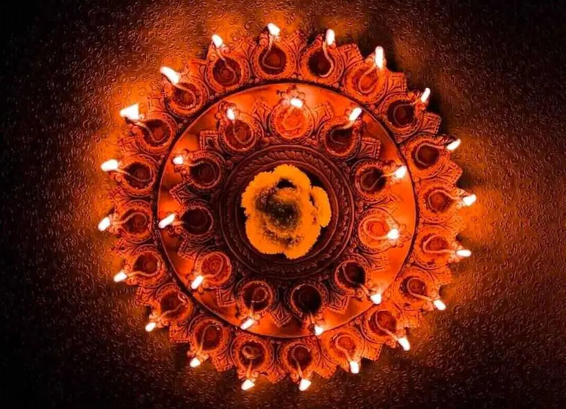 Festival of light clay lamps placed in concentric circles and lit on Diwali
