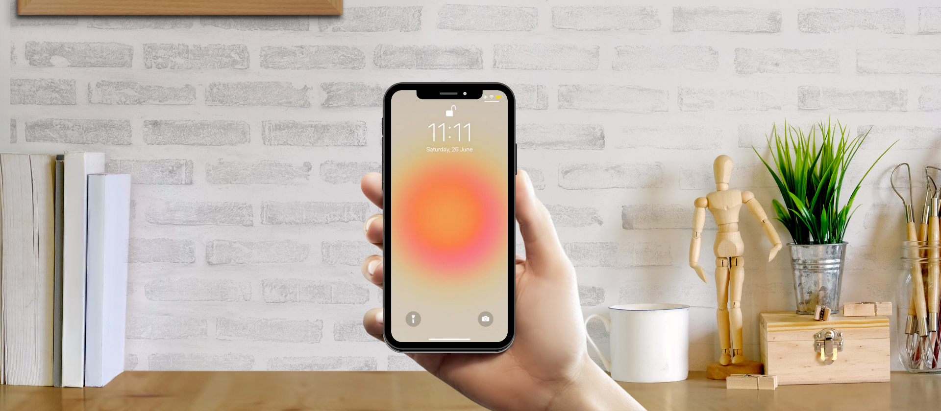 A person holds a phone showing Angel number 11:11