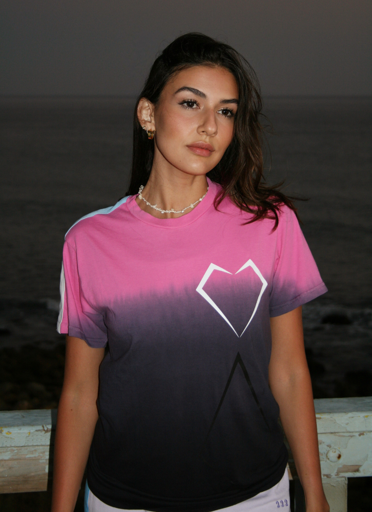 A woman wearing an avant-garde GFLApparel x TimTactics Exclusive T-Shirt.
