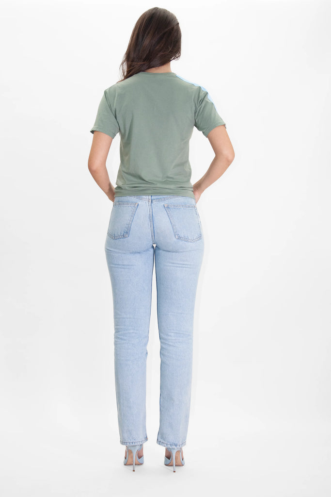 The back view of a woman wearing Angel Number 1111 Tee in Sage by GFLApparel jeans and a t - shirt.