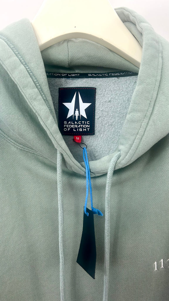 A Angel Number 1111 Hoodie with a blue tag, symbolizing spiritual symbolism from GFLApparel.