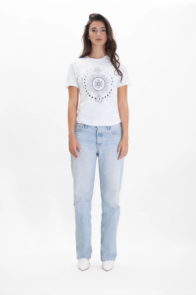 A woman wearing a MOON METATRON TEE IN LITE BEAM t-shirt by GFLApparel and jeans.