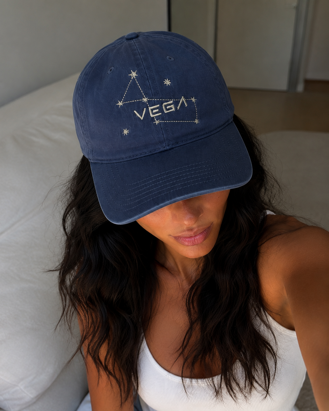 woman wearing Vintage Vega Starseed baseball cap featuring the Lyra constellation embroidered in metallic thread.