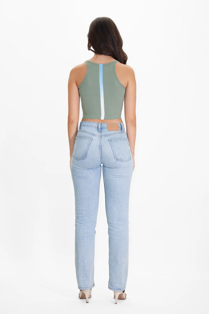 The back view of a woman wearing Angel Number 1111 Cropped Tank in Sage by GFLApparel jeans and a green top.
