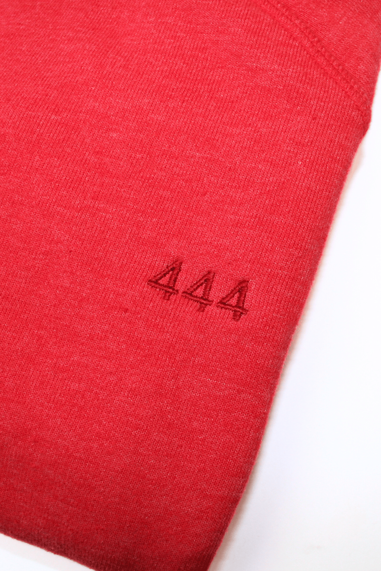 Close-up of a red fabric with a size label reading 