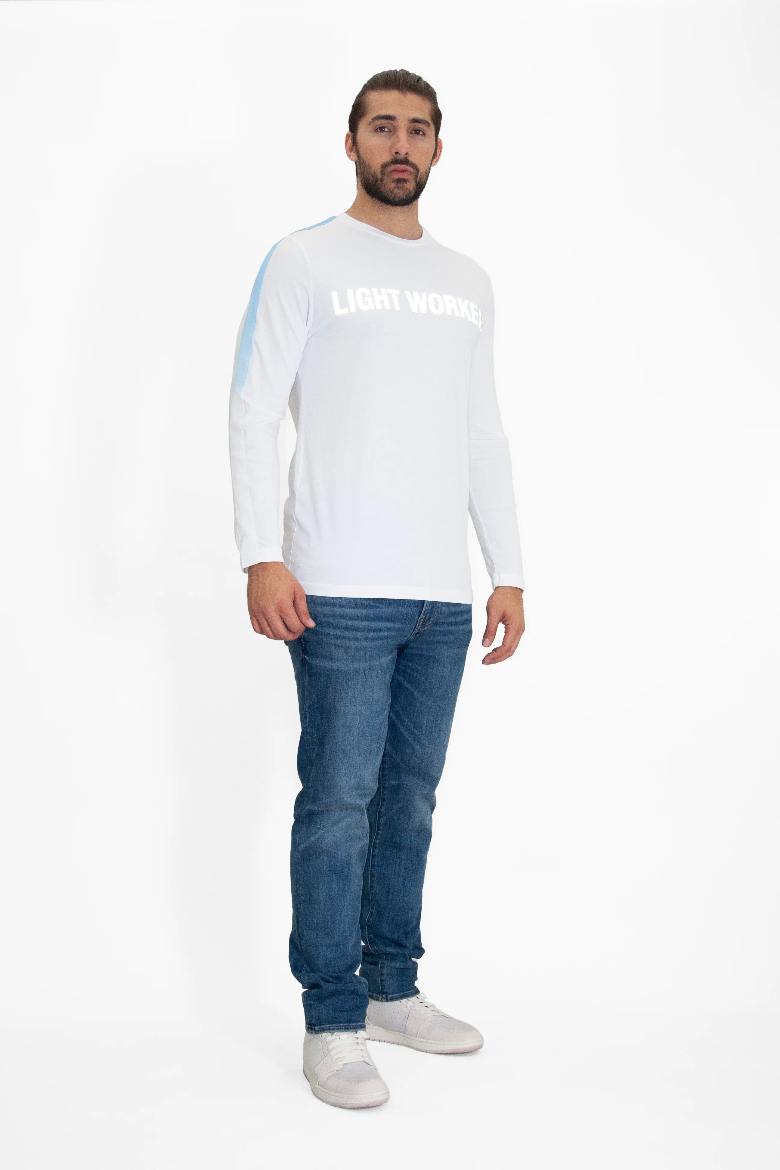 A man with a beard wearing a white long-sleeve cotton T-shirt from GFLApparel called 