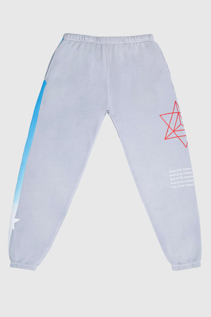 A pair of HYPERGALACTIC PANTS IN GALACTIC GRAY by GFLApparel with a blue and red design.