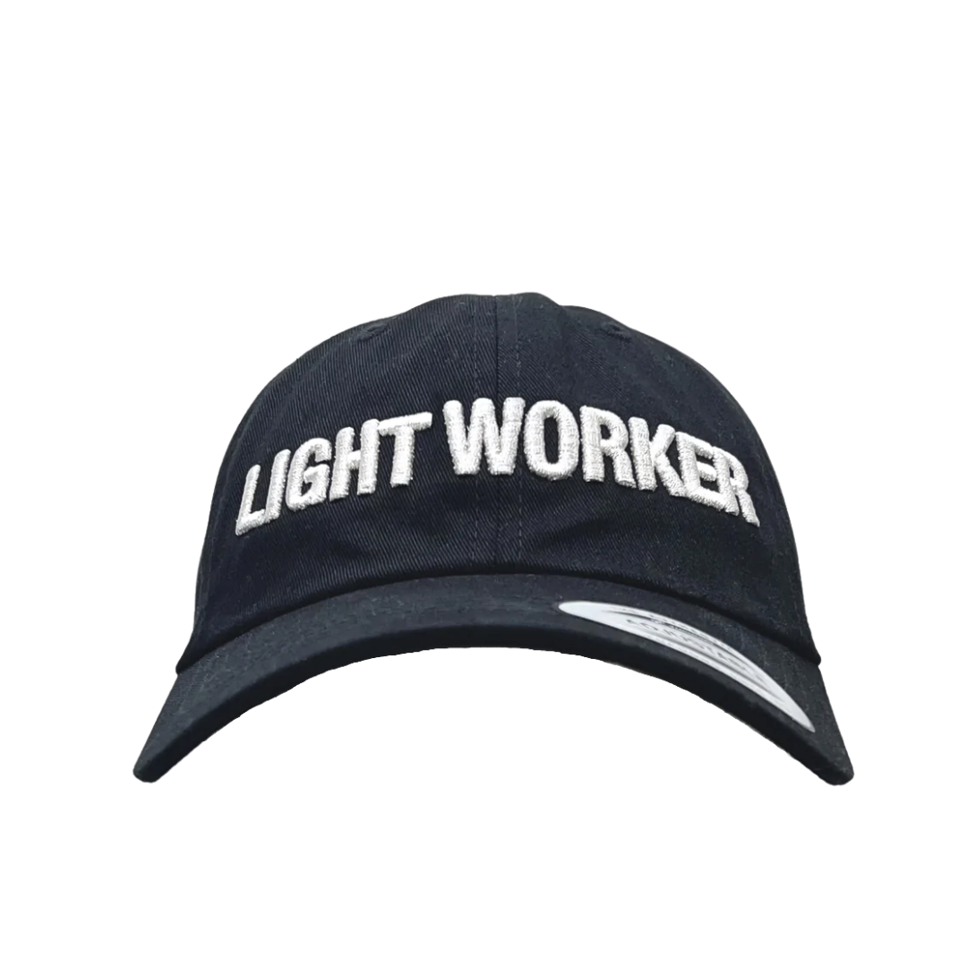 A black baseball cap with white embroidered text reading "LIGHT WORKER" on the front, this must-have staple piece is perfect for any casual outfit. Introducing the Light Worker Baseball Cap from GFLApparel.